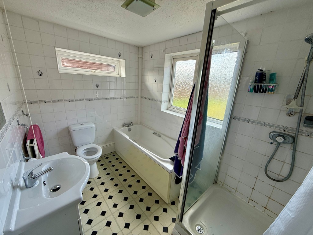 Lot: 106 - THREE-BEDROOM EXTENDED BUNGALOW FOR IMPROVEMENT - Bathroom with shower and W.C.